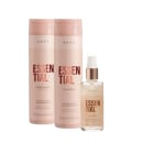 Shampoo e condicionador da linha Essential da marca Braé, com embalagens em tons de rosa claro. Também há um frasco de óleo da mesma linha