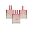Três frascos de perfume Bloom'n Rose da marca de beleza Braé, com embalagens em tons de rosa e detalhes em rosa dourado, apresentando o nome da fragrância em destaque.
