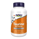 Este é um suplemento alimentar em pó da marca Now Foods. A embalagem é um frasco plástico branco com tampa roxa. O rótulo laranja destaca "Taurine Pure Powder" e menciona benefícios para a saúde do sistema nervoso e função visual.