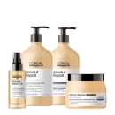 Conjunto de produtos L'Oréal Professionnel da linha Absolut Repair, incluindo shampoo, condicionador, óleo e máscara em embalagens com cores predominantes bege e preto.