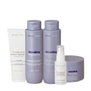 Conjunto de produtos Braé para tratamento de cabelos loiros, incluindo shampoo, condicionador, máscara capilar e creme finalizador, em embalagens de plástico de tons roxos e brancos.