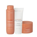 Produtos da linha Braé Stages: shampoo de nutrição, tratamento em creme leave-in e máscara capilar, em embalagens de plástico e cores predominantes de laranja e branco.