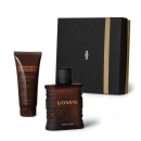 Kit de produtos de beleza da marca Uomini, incluindo um frasco de fragrância escuro com rótulo dourado e uma caixa preta com detalhes em dourado, além de um tubo de creme para barba e pós-barba em embalagem marrom.
