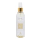 Frasco de spray para uso doméstico da coleção Splendore da marca Kailash, com 150 ml de capacidade. Embalagem em vidro transparente com tampa dourada, rótulo branco com detalhes dourados e texto "Bella".