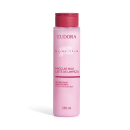 Frasco rosa de 250 ml de leite micelar da linha Niina Secrets da marca Eudora, com tampa vermelha e texto em português descrevendo o produto como "Leite de Limpeza" com tecnologia Skin Secrets com niacinamida.