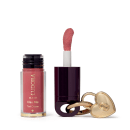 O produto de beleza Eudora Make apresenta um batom líquido rosa em embalagem cilíndrica, acompanhado de um espelho compacto dourado em formato de coração.