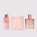 A imagem mostra três produtos da marca Brae: sérum Divine Plume, máscara Glow Shine e perfume capilar Blooming Rose. As cores predominantes são rosa claro e dourado.