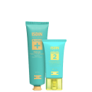 São dois produtos de cuidados para pele oleosa da marca ISDIN. Um é uma máscara facial purificante em um tubo de plástico verde claro com detalhes em dourado. O outro é um controle de brilho e imperfeições em um tubo menor da mesma cor.