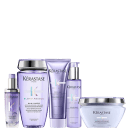 A coleção de produtos de beleza da marca Kérastase. Os rótulos exibem o nome da linha "Blond Absolu", indicando que esses produtos são voltados para cabelos loiros.