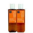 Dois frascos de plástico laranja com bombas brancas, contendo Shampoo Original e Condicionador Original da marca Mise en Scène. Os rótulos exibem informações sobre os ingredientes e a marca.