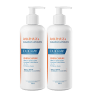 Dois frascos brancos de shampoo Anaphase+ da marca Ducray, com bombas doseadoras, rótulos azuis e laranja indicando propriedades antiqueda e fortalecimento capilar.