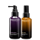 Dois frascos de produtos profissionais da marca Sebastian, um com rótulo roxo "No Breaker" e outro com rótulo dourado "Dark Oil Smooth & Shine Styling Oil", ambos com embalagens pretas e bombas de spray.