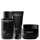 Conjunto de produtos de beleza da marca Sebastian Professional, incluindo um frasco de shampoo, um tubo de condicionador e um pote de máscara, todos em embalagens pretas com detalhes dourados, exibindo o nome da marca.