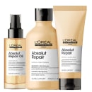A imagem mostra três produtos da linha Absolut Repair da L'Oréal Professionnel. Todos possuem embalagem amarela, com tampa preta.