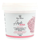 Pote branco com rótulo da marca Blue Moon, contendo "Argila Rosa" em texto cursivo. Embalagem de 100g, com informações sobre os benefícios do produto para pele, cabelo e corpo.