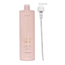 Condicionador Glow Shine da marca Brae. Embalagem plástica rosa claro com bomba dosadora branca. Rótulo com o nome do produto "Glow Shine" e descrição em letras douradas. Frasco de 338 fl oz. Design minimalista e elegante.
