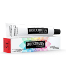 Tubo de creme de coloração permanente da marca Bio Extratus, com embalagem em caixa vermelha e preta. O produto é apresentado em um tubo branco com rótulo preto e texto "Bio Extratus C.O.L.O.R" em destaque.