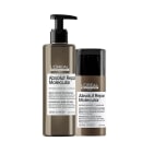 A imagem mostra um kit da L’Oréal Professionnel. Um frasco de sérum comprido, com pump preto e um frasco de máscara com tampa preta. Ambos com embalagem marrom e rótulo branco.