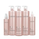 5 produtos da linha dispostos lado a lado, embalagens na cor rosa claro com letras prateadas.