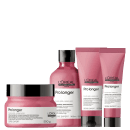 A imagem mostra um kit da L'Oréal Professionnel Pro Longer com um pote arredondado de máscara, um frasco arredondado de shampoo e duas bisnagas com leave-in e condicionador. Todos de cor rosa escuro, rótulo branco e tampa preta.