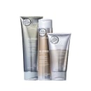 A imagem mostra três produtos da linha Blonde Life da marca Joico: um condicionador, um shampoo e uma máscara, todos em embalagens com tons dourados e prateados.