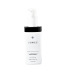 A imagem mostra um produto facial com frasco branco, com detalhes pretos e uma tampa protetora de cor branca com um dispensador em forma de bomba. A embalagem indica o nome do produto e seu conteúdo de 120ml.