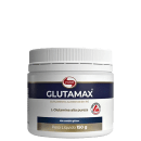 O produto é um suplemento alimentar em pó da marca Vitafor chamado Glutamax, contendo L-glutamina de alta pureza. A embalagem é um pote branco com rótulo azul e dourado, pesando 150 gramas.