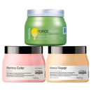 Três máscaras capilares. A primeira é um pote verde de 500g chamado "Force Relax", descrito como uma "máscara nutri-control". Os outros dois de 500g cada, um rosa intitulado "Vitamino Color" e um bege chamado "Absolut Repair Protein + Gold Quinoa".