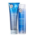 Shampoo e condicionador da linha Moisture Recovery da marca Joico. Ambos os produtos têm embalagem na cor azul com detalhes em branco e prateado.