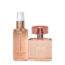Dois produtos de beleza da marca Braé são mostrados. Um é um frasco de perfume feminino cor de rosa com detalhes em tom cobreado. O outro produto é um óleo capilar brilhante em um frasco transparente com líquido dourado e tampa branca.
