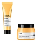 A imagem mostra dois produtos de tratamento capilar da linha NutriOil da L'Oréal Professionnel. Um é um tubo contendo uma creme nutritivo com proteção térmica. O outro é um pote plástico dourado com tampa preta, contendo uma máscara capilar de nutrição.