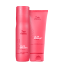 A imagem mostra um shampoo em um frasco cilíndrico rosa de 250ml e um condicionador em um tubo rosa de 200ml. Ambos os produtos têm o logotipo da Wella e as informações do produto impressas nas embalagens na cor branca.