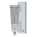 O produto apresentado é um tubo de tinta para cabelo da marca Keune, da linha Semi Color. A embalagem é predominantemente cinza, com o nome da marca e da linha impressos em preto. O tubo contém o produto.