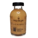 A imagem mostra um frasco de ampola pequeno, transparente, com produto dourado e tampa preta.