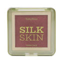 Blush em pó Ruby Rose, com o nome "Silk Skin" impresso em letras grandes. A embalagem é retangular, com uma tampa transparente que permite visualizar o conteúdo. A cor predominante do blush é um tom rosado escuro.