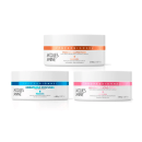 Três potes de máscaras capilares da marca Jacques Janine Professionnel, com rótulos indicando diferentes tratamentos: Power Nutrition, Hidratação Profunda e Reconstrução Total. As embalagens são brancas com detalhes em laranja, azul e rosa.