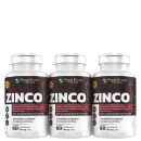 Três frascos de suplemento alimentar em cápsulas de zinco da marca Floral Ervas do Brasil. Rótulos marrons com o nome "ZINCO" e informações sobre o produto, como "100% da Ingestão Diária Recomendada", "60 cápsulas de 350mg cada"