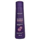 Condicionador Ilumini Blond Matizador da linha Verde Brasil Cosméticos. Embalagem de 390ml na cor roxa escura. Rótulo com o nome do produto "Ilumini Blond Matizador" e descrições como "Condicionador Platinum", "Açaí Jabuticaba" e "Ação matizadora"