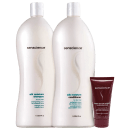 A imagem mostra dois grandes frascos de plástico branco opaco com tampas brancas, contendo shampoo e condicionador. Ao lado, um tubo vinho com a embalagem de uma máscara hidratante da mesma marca.