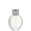 Perfume em frasco redondo de vidro transparente com tampa prateada. O frasco tem formato oval e não apresenta rótulos ou textos visíveis. A embalagem é minimalista, destacando a forma elegante do frasco e a cor prateada da tampa metálica.