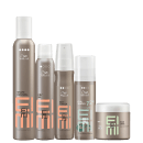 A imagem mostra 5 produtos de Wella Professionals da linha EIMI. São 4 frascos cilíndricos em spray e um pote redondo, todos na cor marrom.