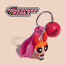 Balm labial em formato de chaveiro das Meninas Superpoderosas, com embalagem rosa e laranja em formato de uma das personagens.