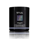 Máscara matizadora platinada em embalagem preta. Produto da linha #ItBlond da marca Stijl. Embalagem cilíndrica preta com detalhes em letras brancas e roxas. Rótulo indica que neutraliza tons amarelados e tonaliza cabelos loiros.