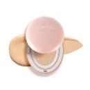 Produto de maquiagem em embalagem compacta de cor rosa com a marca "TIRTIR" impressa. Contém uma esponja de aplicação em tom bege e uma superfície dourada, provavelmente um produto de base ou corretivo.