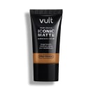 Bisnaga preta da marca Vult contendo Base Líquida Iconic Matte com acabamento natural, longa duração e cobertura média, sem transferência e com Tecnologia Pro-Finish.
