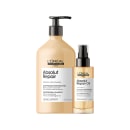 Dois produtos de cabelo da marca L'Oréal Professionnel: um frasco de shampoo Absolut Repair e um frasco de óleo Absolut Repair Oil, ambos em embalagens de plástico com cores claras e rótulos pretos.
