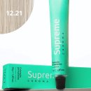 A imagem mostra a embalagem em tubo plástico verde claro com o nome da marca e produto impresso. Caixa retangular verde com detalhes do produto, incluindo a cor e o volume de 50g. No canto superior há uma pequena mecha com o tom da coloração.