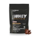Suplemento alimentar em pó da marca Nutrends, da linha Elite Series. A embalagem é um pacote preto com o logotipo da marca e a informação "100% Whey Protein" em destaque.