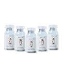 Cinco frascos de vidro transparente contendo o produto "Liquid Keratin Mask Power Dose" da marca Braé, com rótulos brancos e detalhes em cor de rosa.