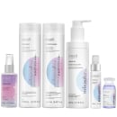 Conjunto de produtos de cuidados capilares da marca Emáh, incluindo shampoo, condicionador, leave-in, óleo e máscara em embalagens brancas e coloridas com detalhes em rosa e azul.
